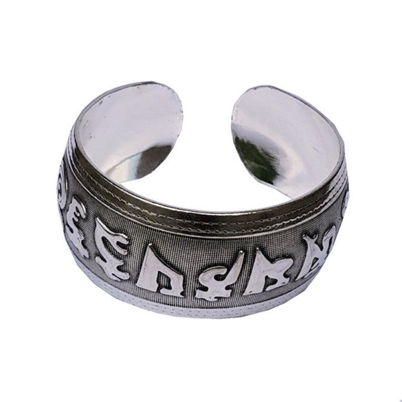 None Other - This is a pewter Tibetan "Om Mani Padme Hum" mantra cuff bracelet.